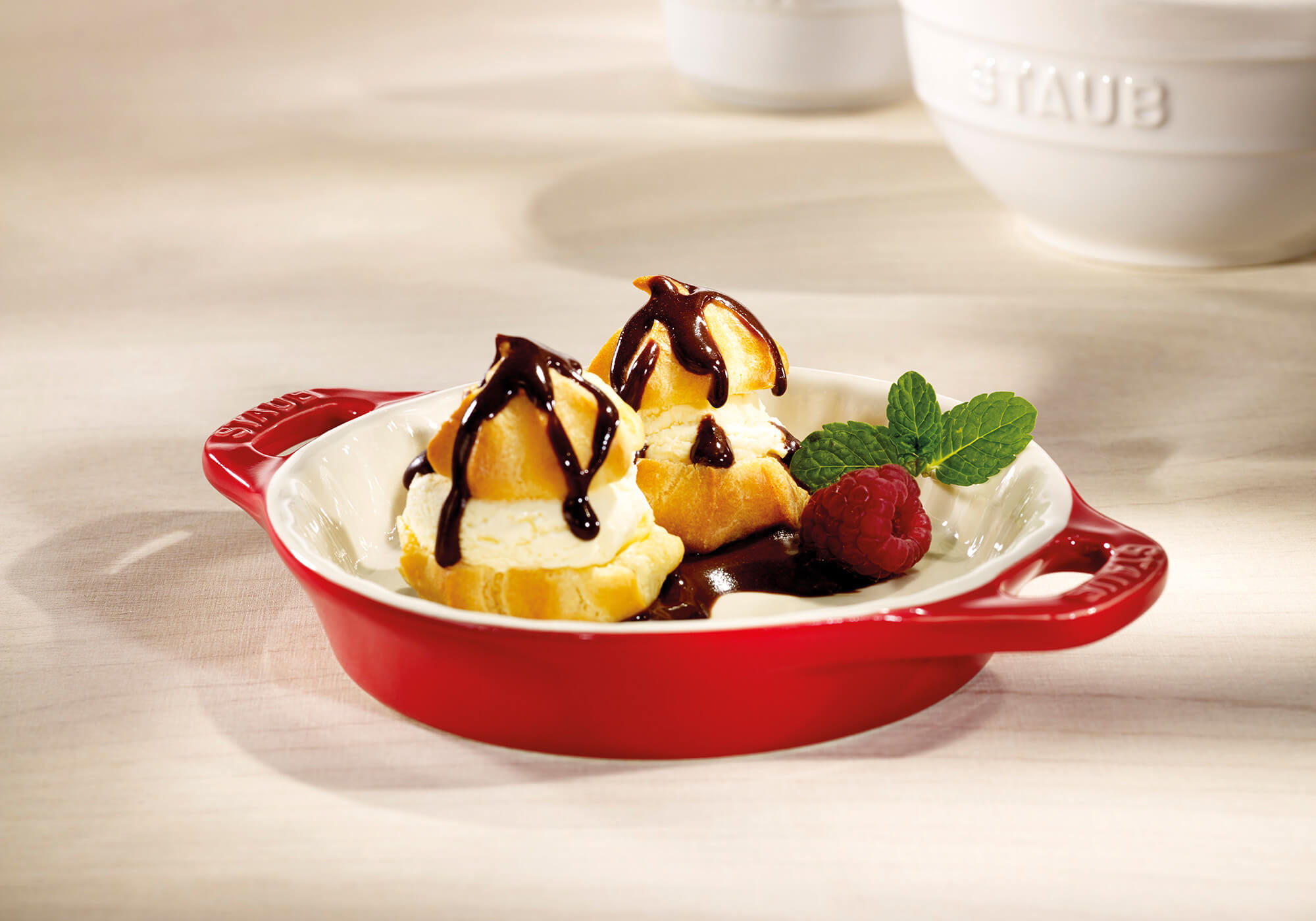 Choux pastry donuts with vanilla ice cream and chocolate sauce