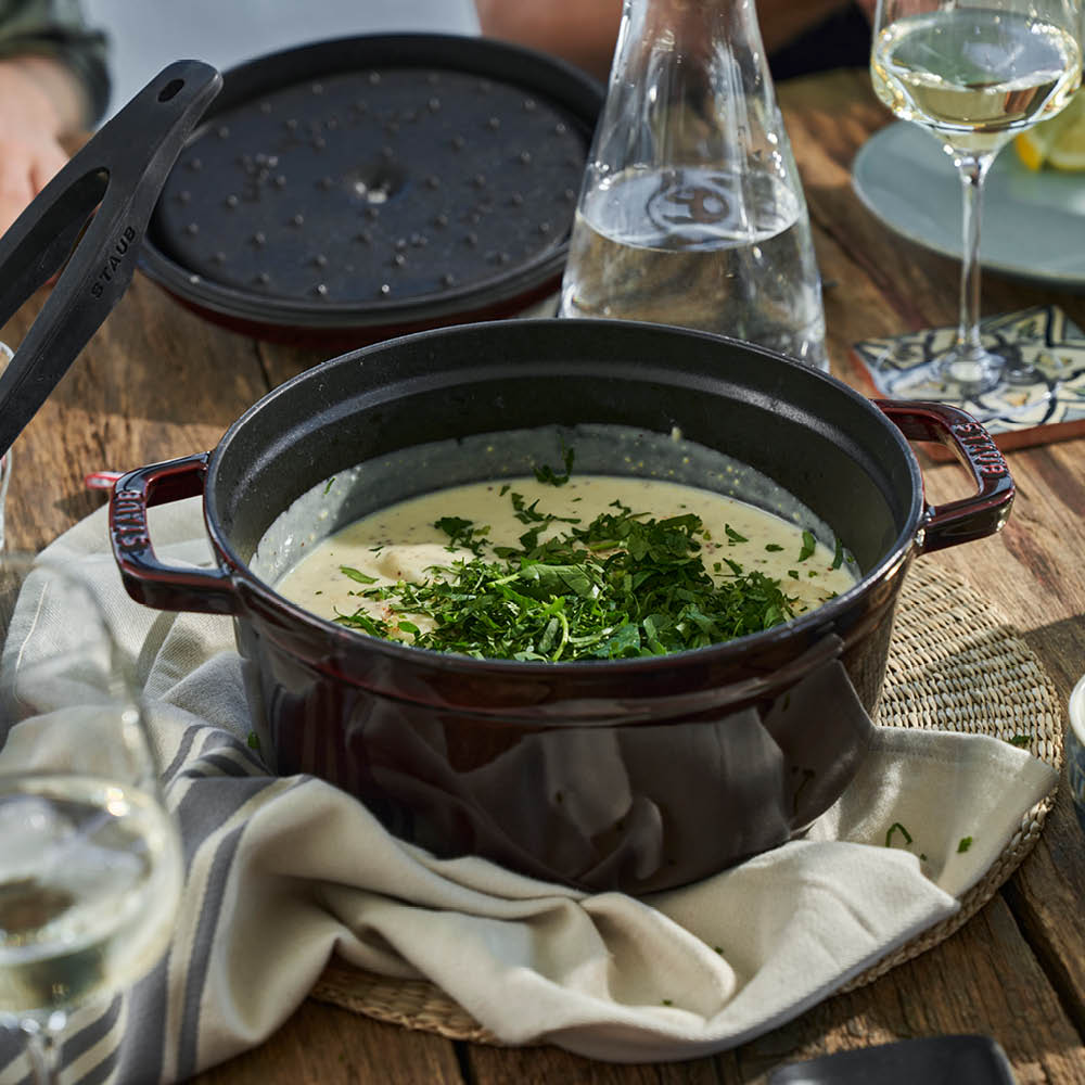 https://www.zwilling.com/on/demandware.static/-/Sites-zwilling-us-Library/default/dw1c10dcd3/images/product-content/masonry-content/staub/cast-iron/cocotte/40509-357-0_Product_In_Use_OS_750x750_1.jpg